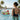 Woman in pool - White Floral.jpg__PID:06b29955-d62e-4077-a2af-7cad9250ec25